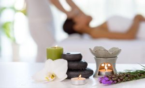 Zen stones, candles, and flowers at a spa