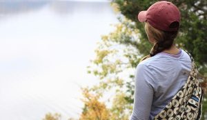 Woman hiking by a lake